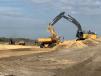 Roughly 90 craft workers keep large excavators, bulldozers, off-road dump trucks and cranes moving throughout the project site.   (Photo courtesy of Superior Construction )